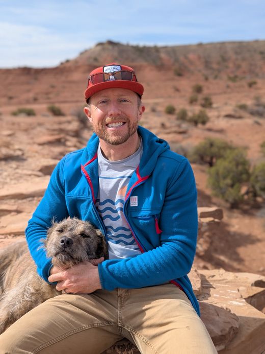 Abe Bergan, founder of Blaze Blocker, with his dog in the Colorado backcountry